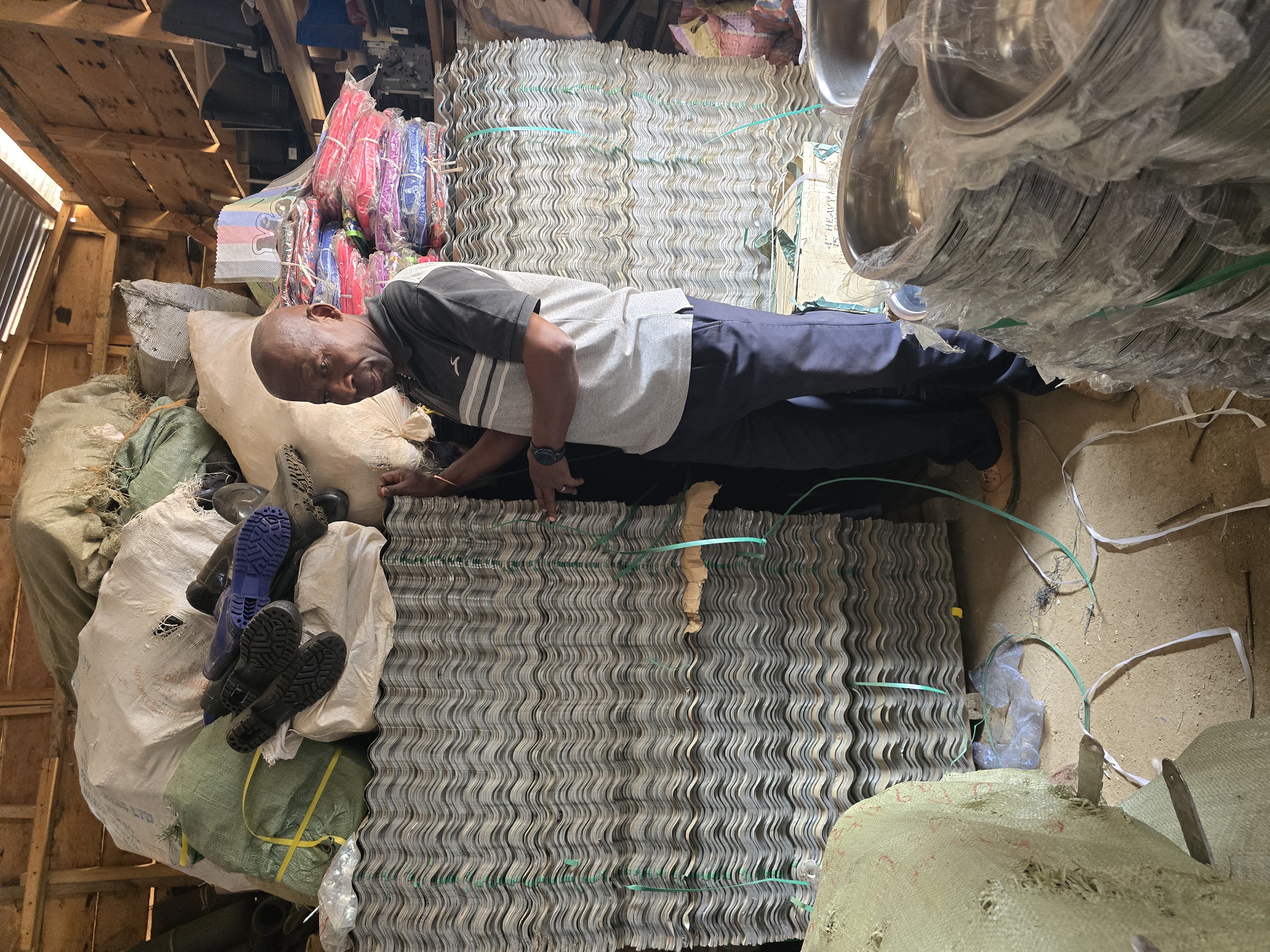 Warehouse staff checking labeled packages on shelving for safe storage